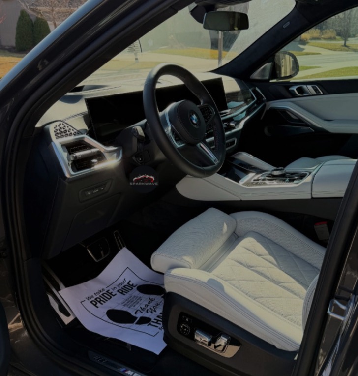 BMW interior with white quilted leather seats after a Sparkwave detail