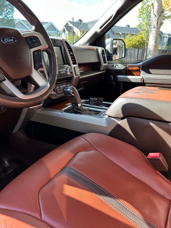 Ford F-150 front seats in tan leather after interior detail