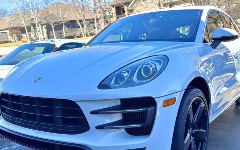 White Porsche Macan with glossy paint after a detail