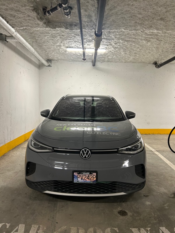 Grey Volkswagen ID.4 freshly washed in a parkade